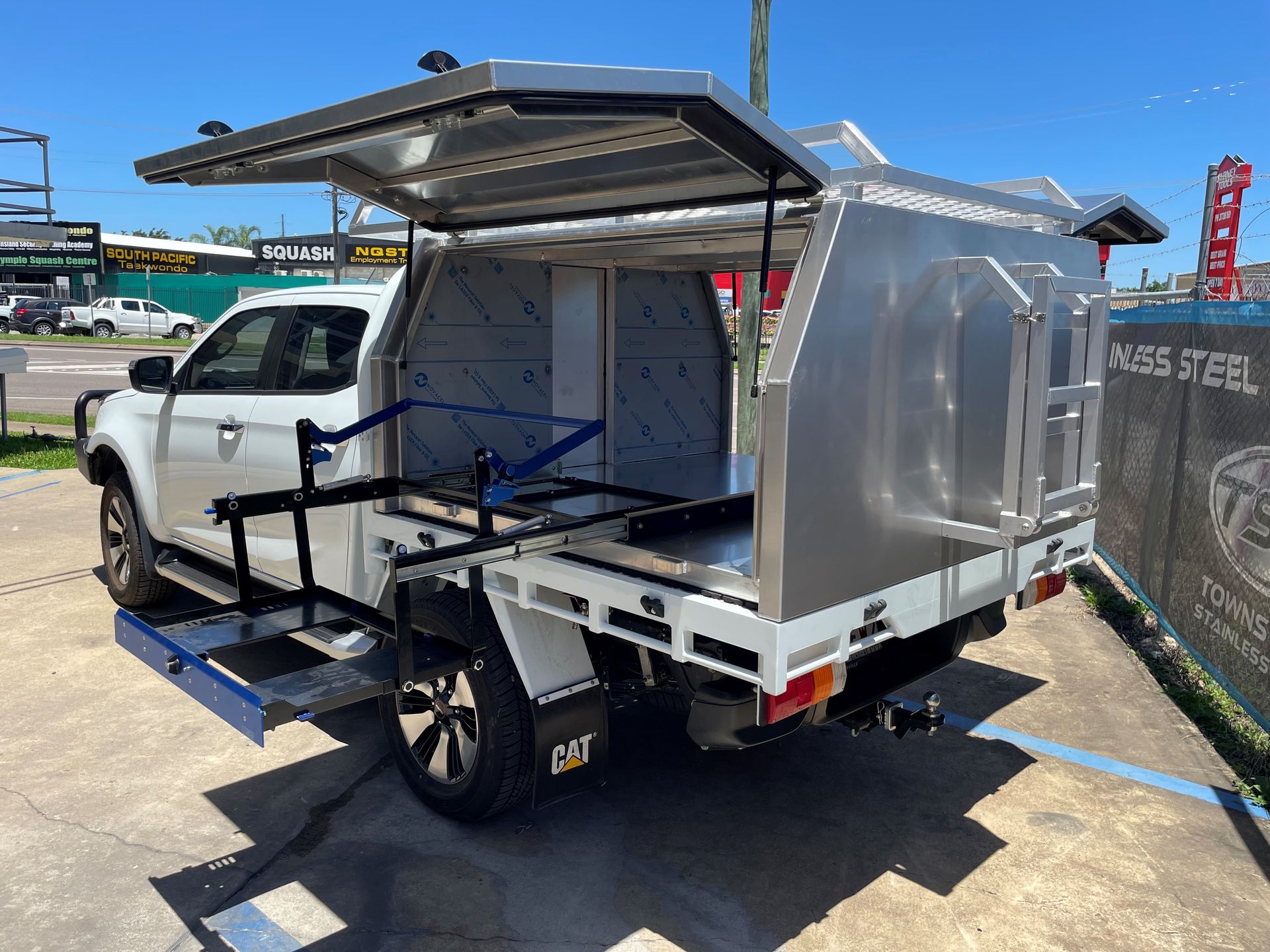 A Man Wearing A Welding Mask Is Welding A Piece Of Metal — Townsville Stainless Steel in Garbutt, QLD