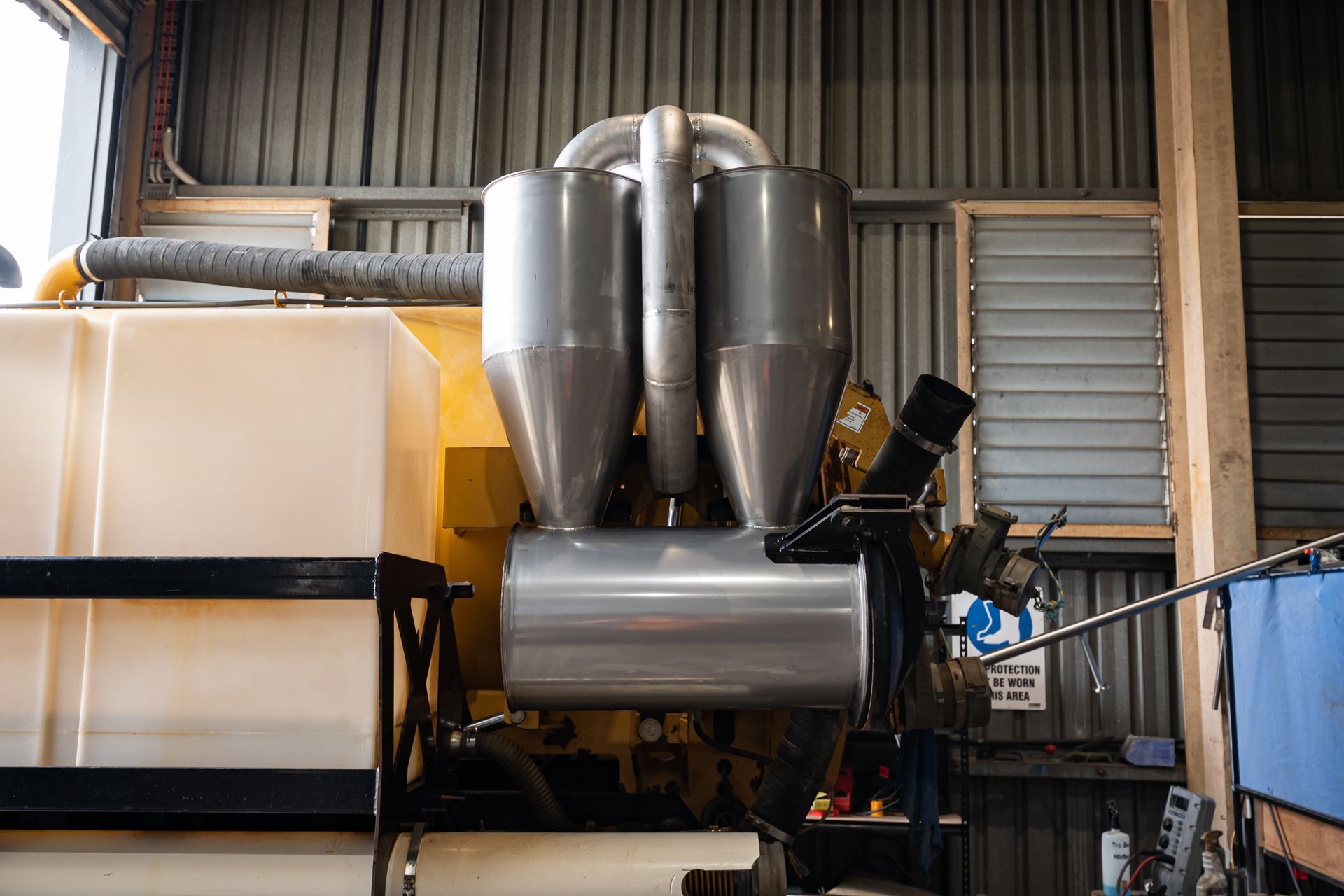 A Complex Industrial Machine With Silver Funnels and Tubes — Townsville Stainless Steel in Garbutt, QLD