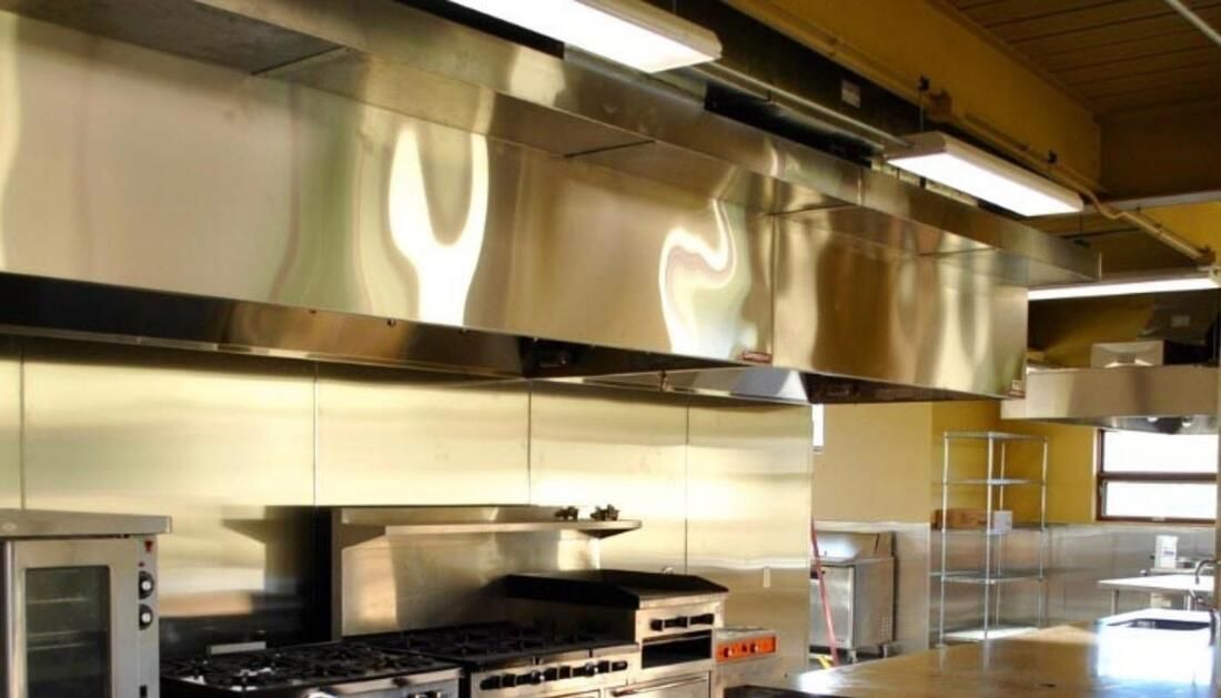 A Kitchen with Stainless Steel Appliances and A Microwave Oven  — Townsville Stainless Steel in Garbutt, QLD