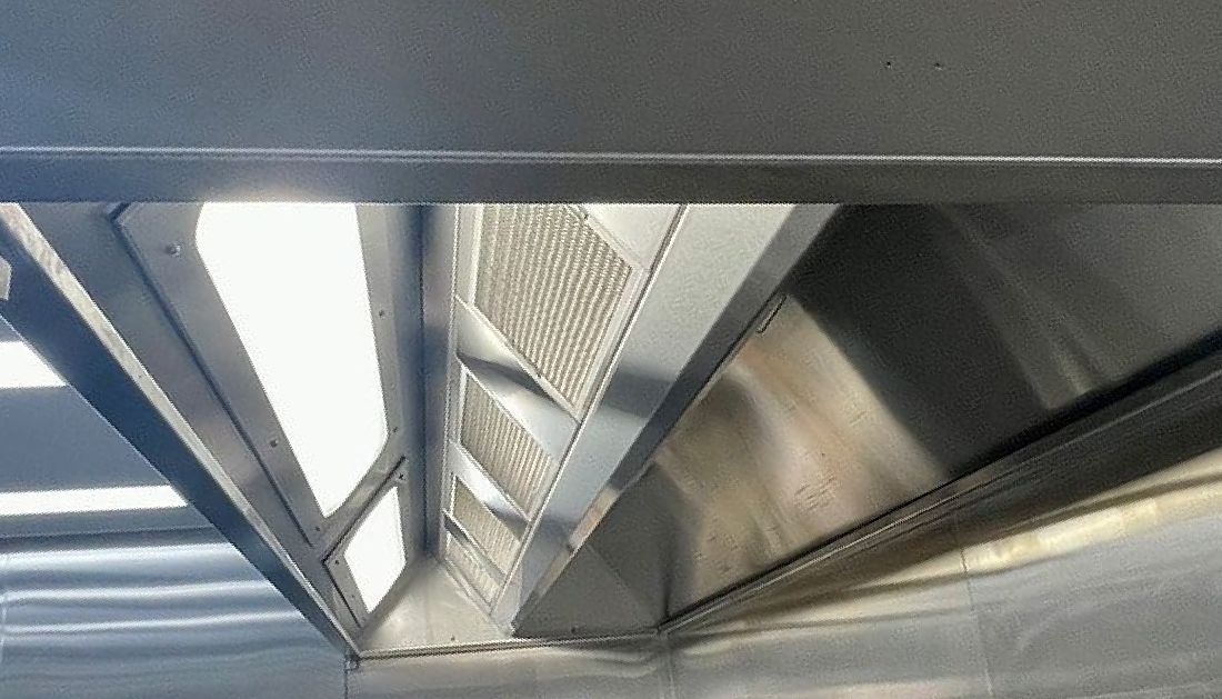 A Close up Of a Stainless Steel Exhaust Hood in A Kitchen  — Townsville Stainless Steel in Garbutt, QLD