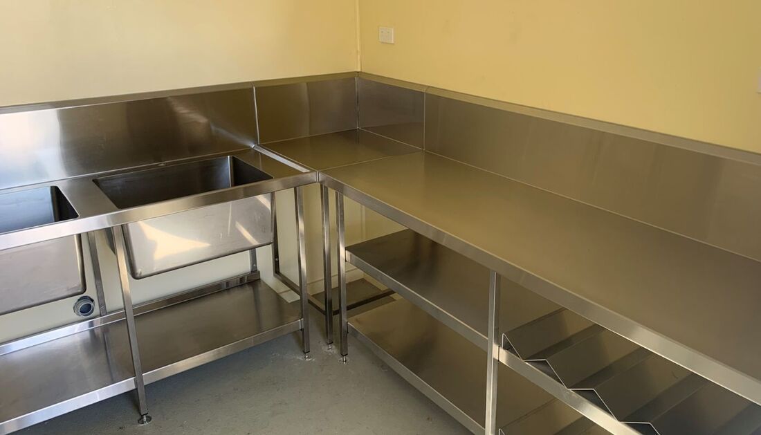 A Kitchen with Stainless Steel Counter Tops and Sinks — Townsville Stainless Steel in Garbutt, QLD A Kitchen with Stainless Steel Counter Tops and Sinks — Townsville Stainless Steel in Garbutt, QLD