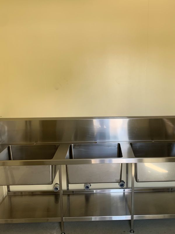A Stainless Steel Kitchen Sink with Two Sinks and A Shelf — Townsville Stainless Steel in Garbutt, QLD A Stainless Steel Kitchen Sink with Two Sinks and A Shelf — Townsville Stainless Steel in Garbutt, QLD