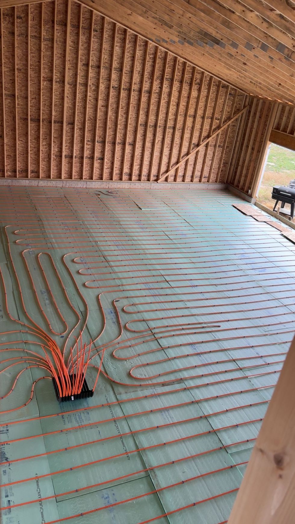 Air conditioning units with toolbox and gloves in backyard.