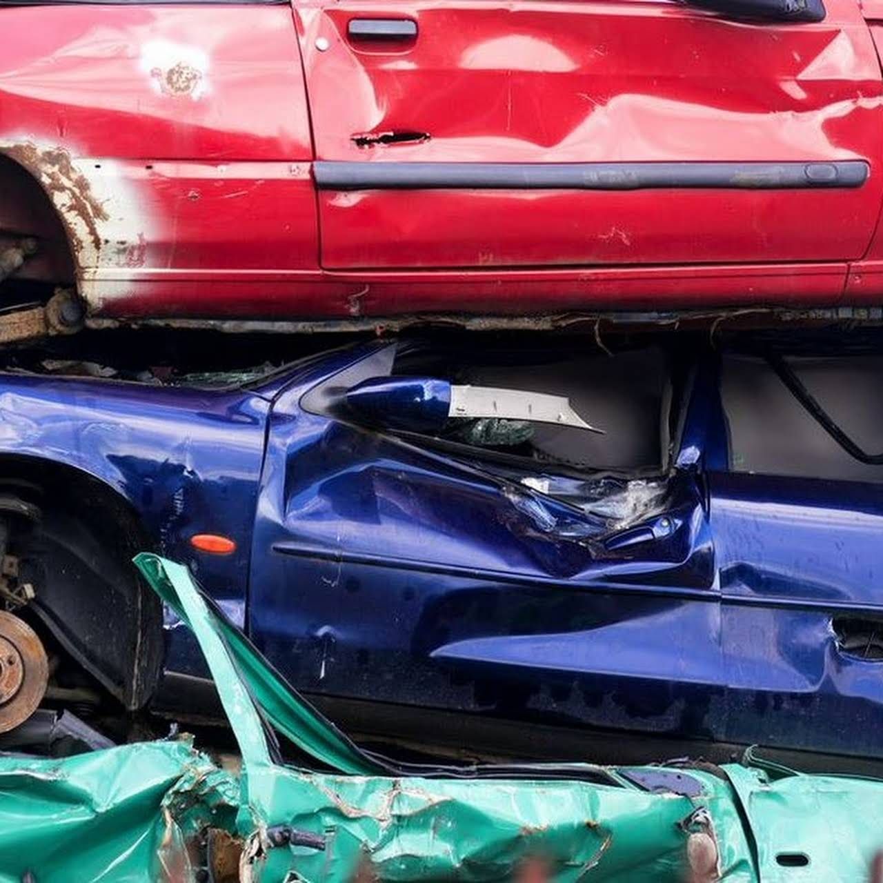 A Damaged Car Is Driving Down A Highway At Night — Old Bar Wreckers In Gloucester, NSW