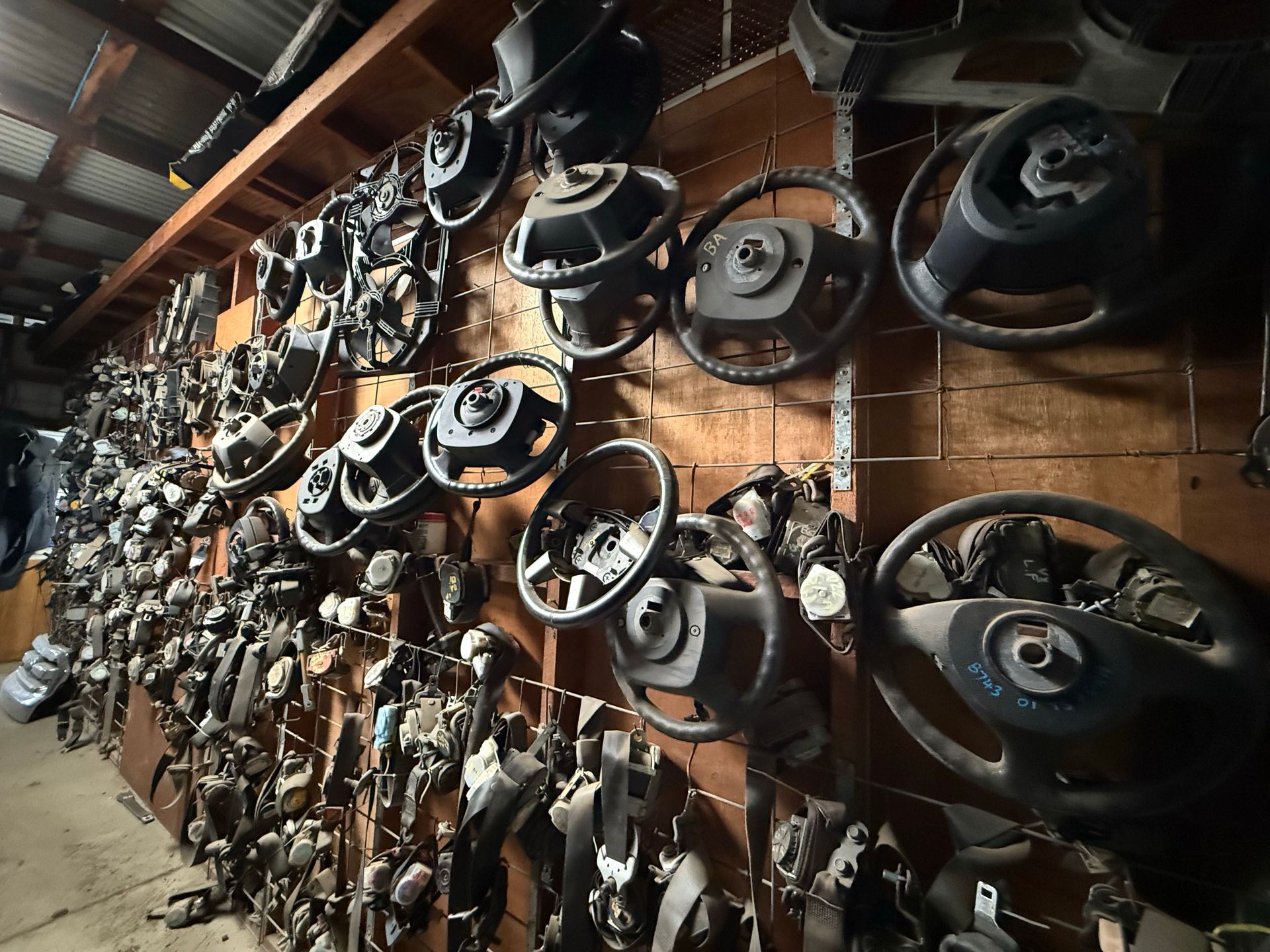 There Are Many Different Types Of Metal Parts On The Table — Old Bar Wreckers In Glenthorne, NSW
