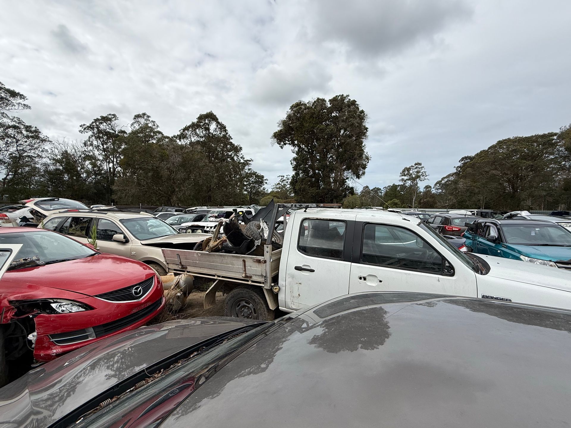 Three Cars Stacked On Top Of Each Other To Be Wrecked — Old Bar Wreckers In Old Bar, NSW