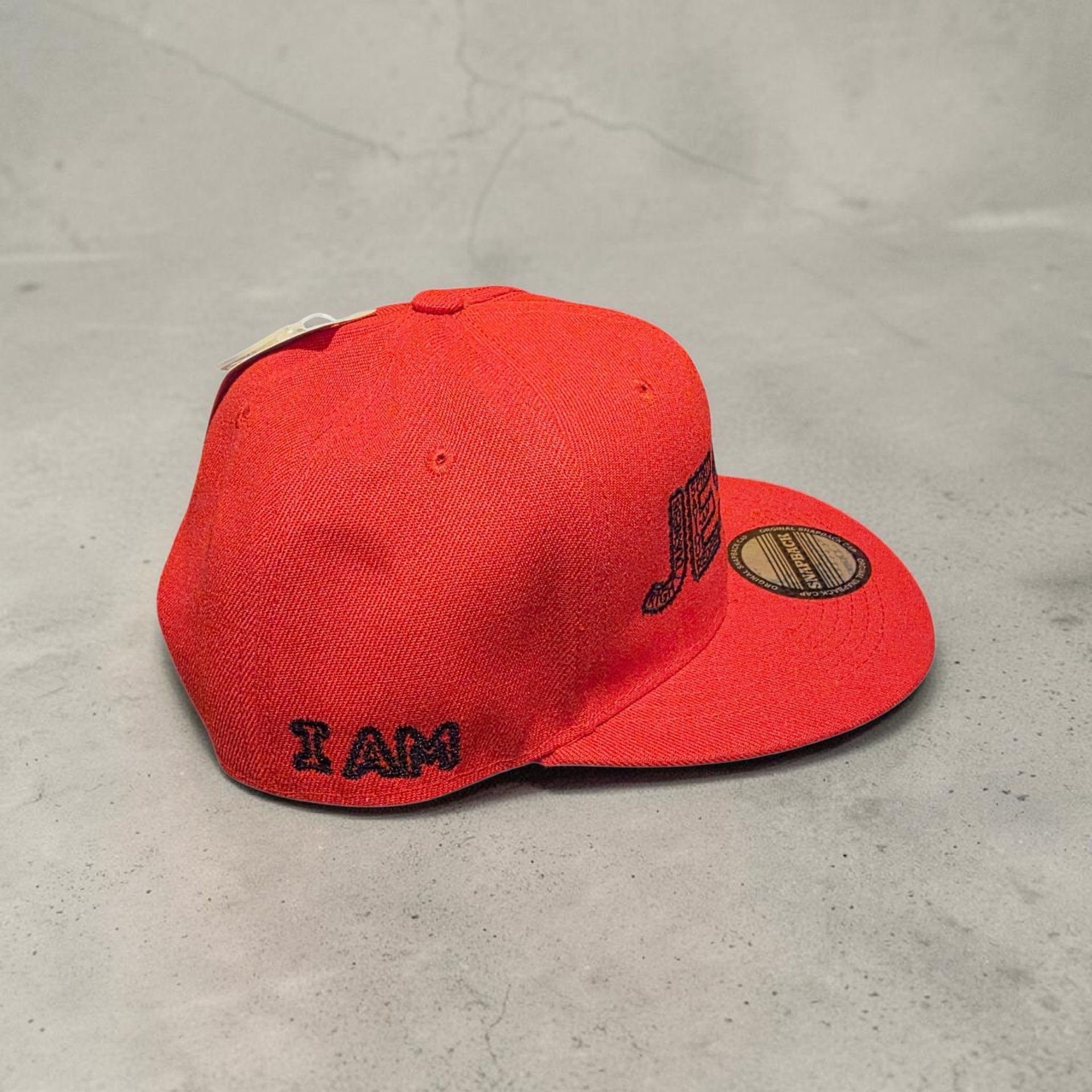 Red hat with black letters- Snap back- one size fits most