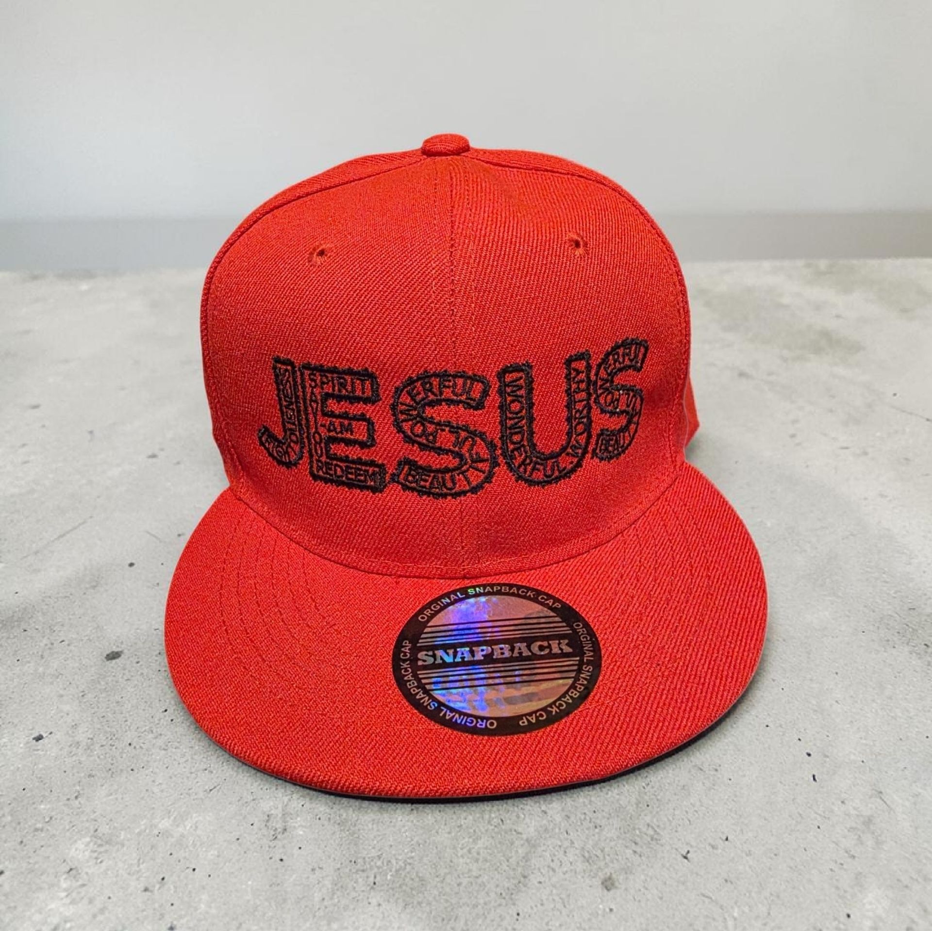 Red hat with black letters- Snap back- one size fits most