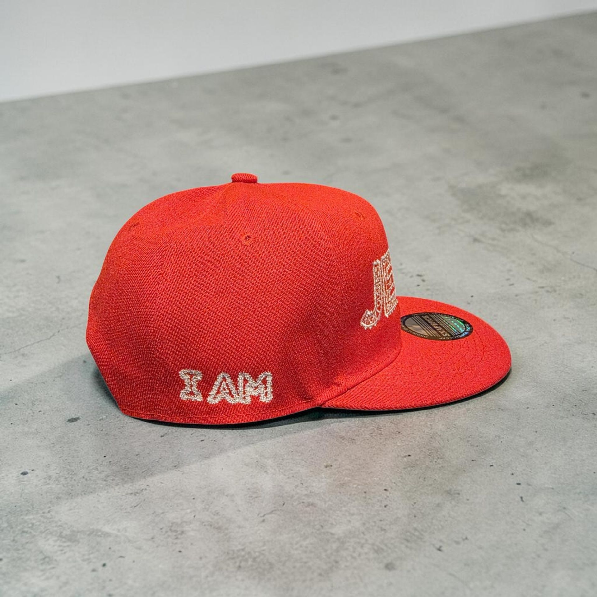 Red hat with white letters- Snap back- one size fits most