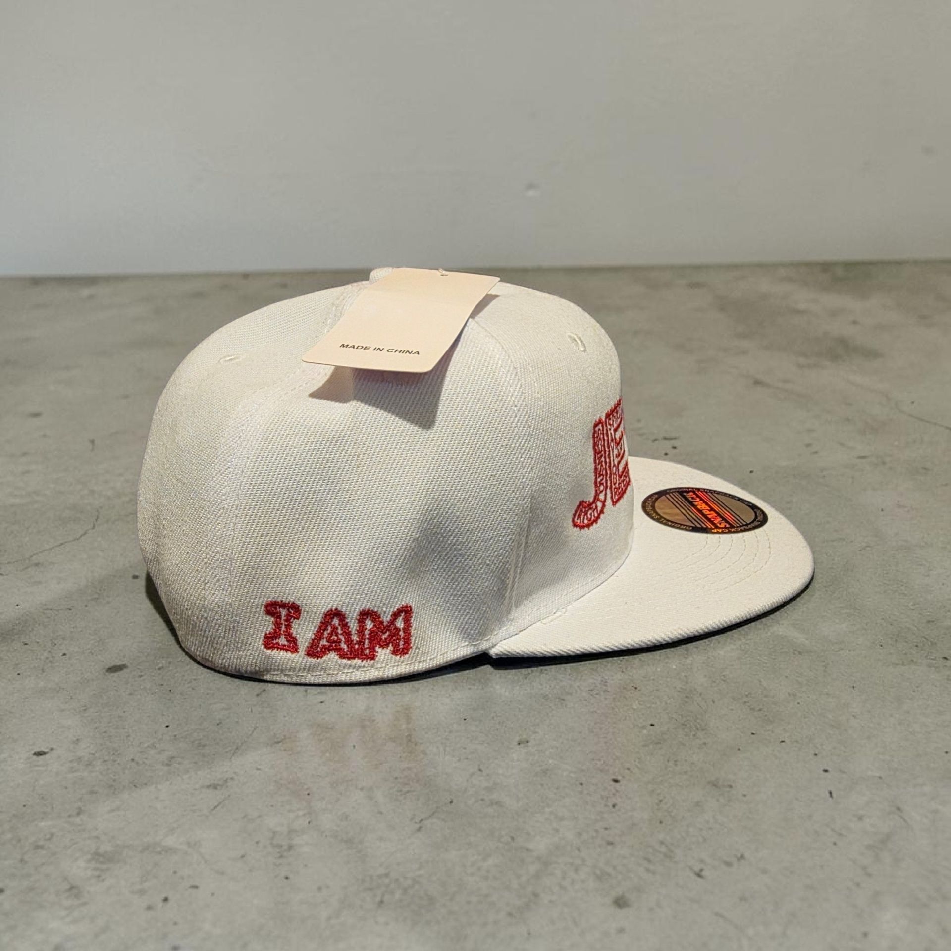 White hat with red letters- Snap back- one size fits most