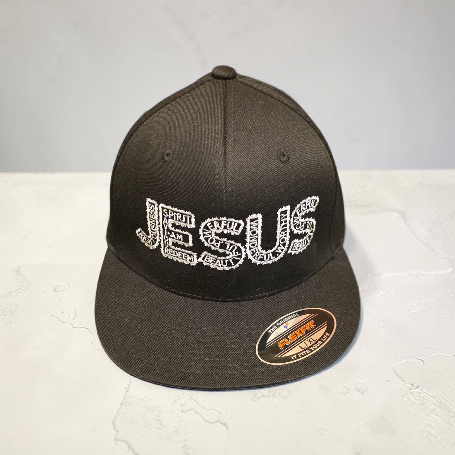 Black hat with white letters- Snap back- one size fits most