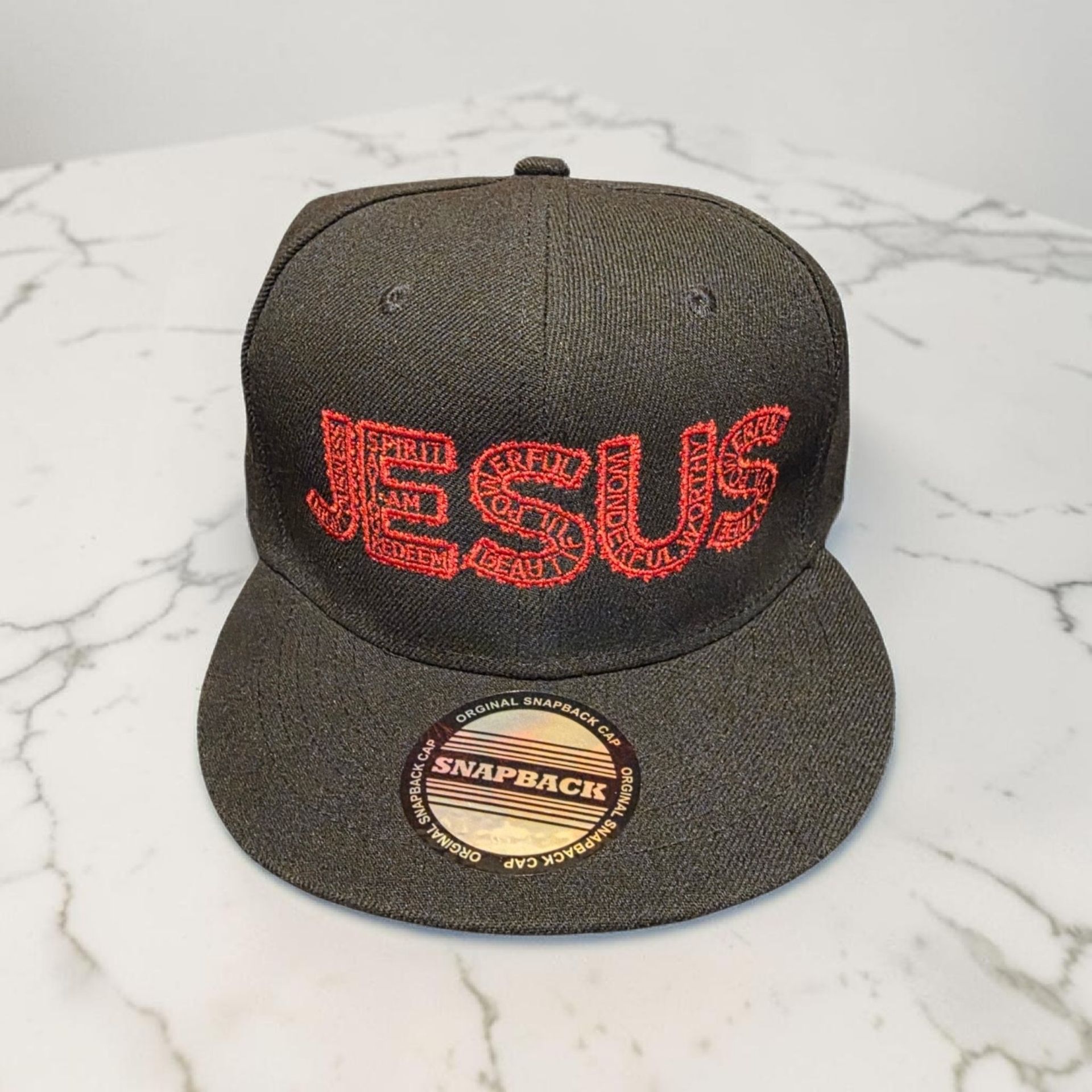 Black hat with red letters- Snap back- one size fits most