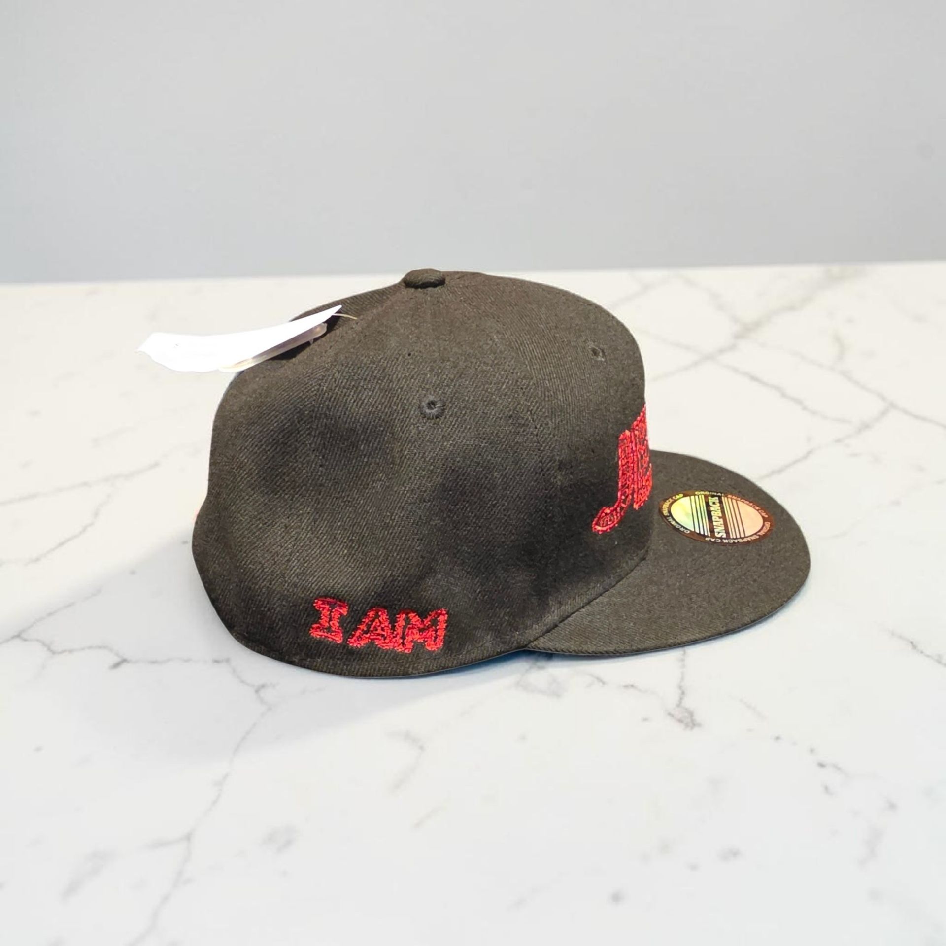 Black hat with red letters- Snap back- one size fits most