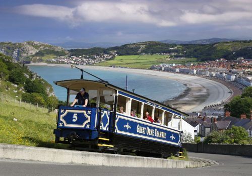 a blue and white train with the number 5 on it