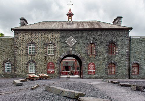 a large stone building with a clock tower on top of it .