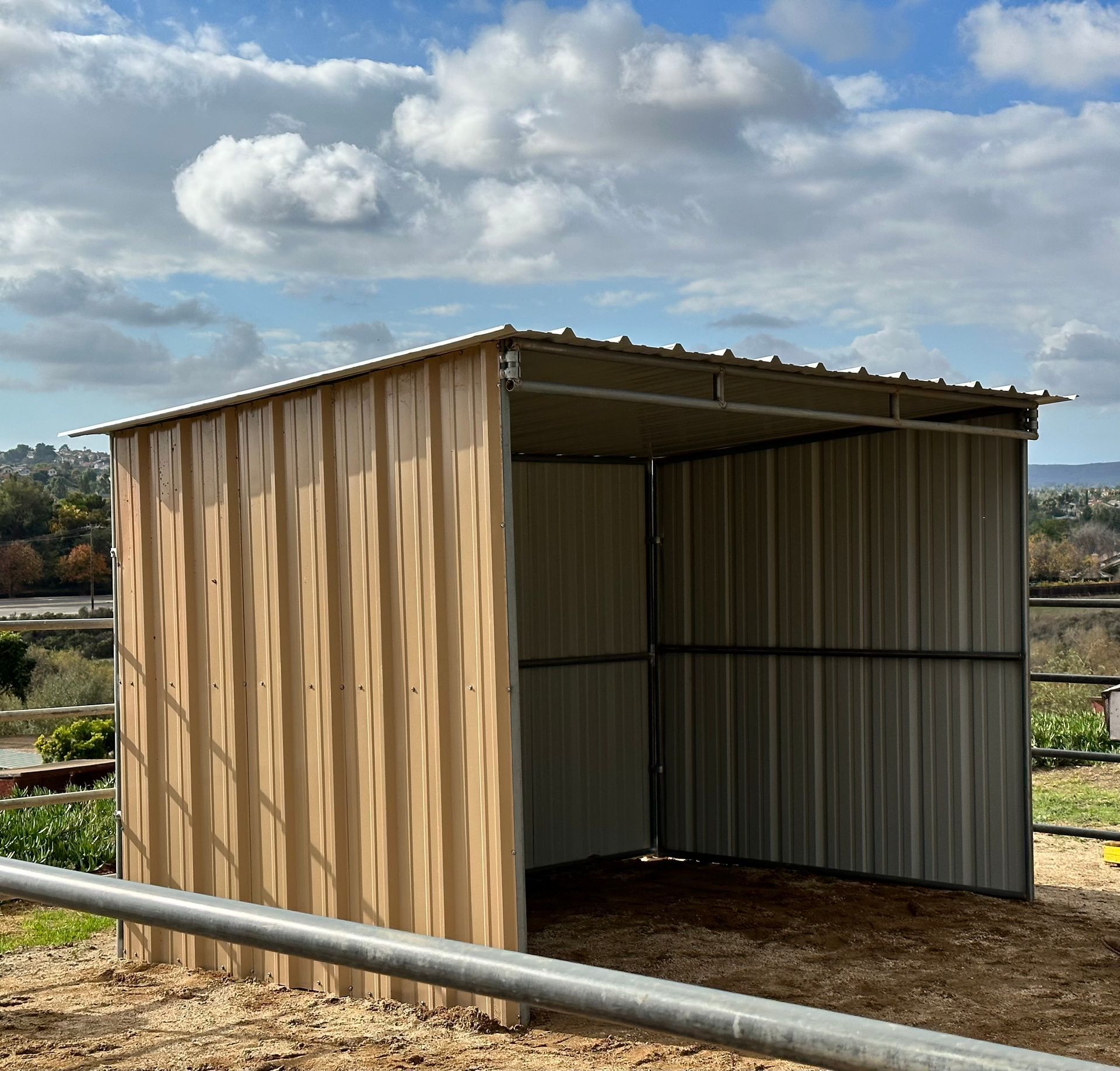 A small wooden shed with a metal roof