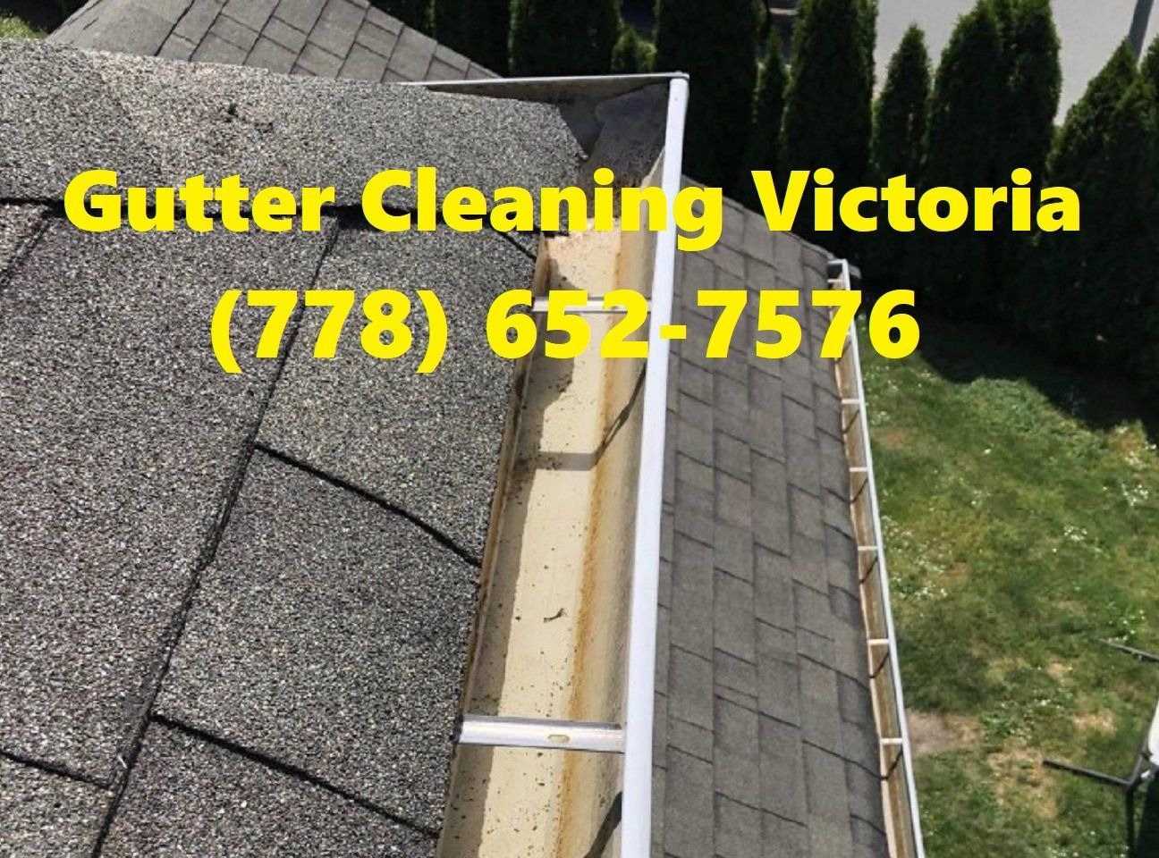Photo of a gutter we thoroughly cleaned and flushed out with a hose to ensure all water entering the gutter was flowing to the downspouts and not leaking & overflowing on various parts of their property