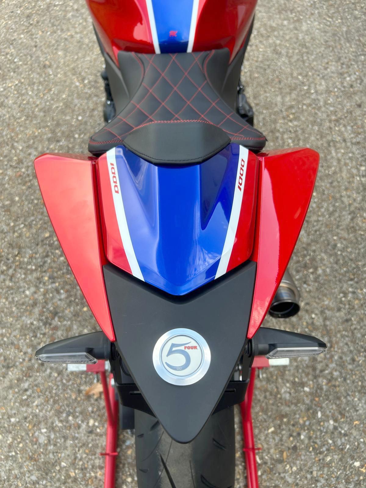 Red, white, and blue motorcycle tail with custom seat and