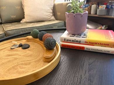 Sand tray, sensory tools, and books in Joy Strickland’s Fayetteville therapy office