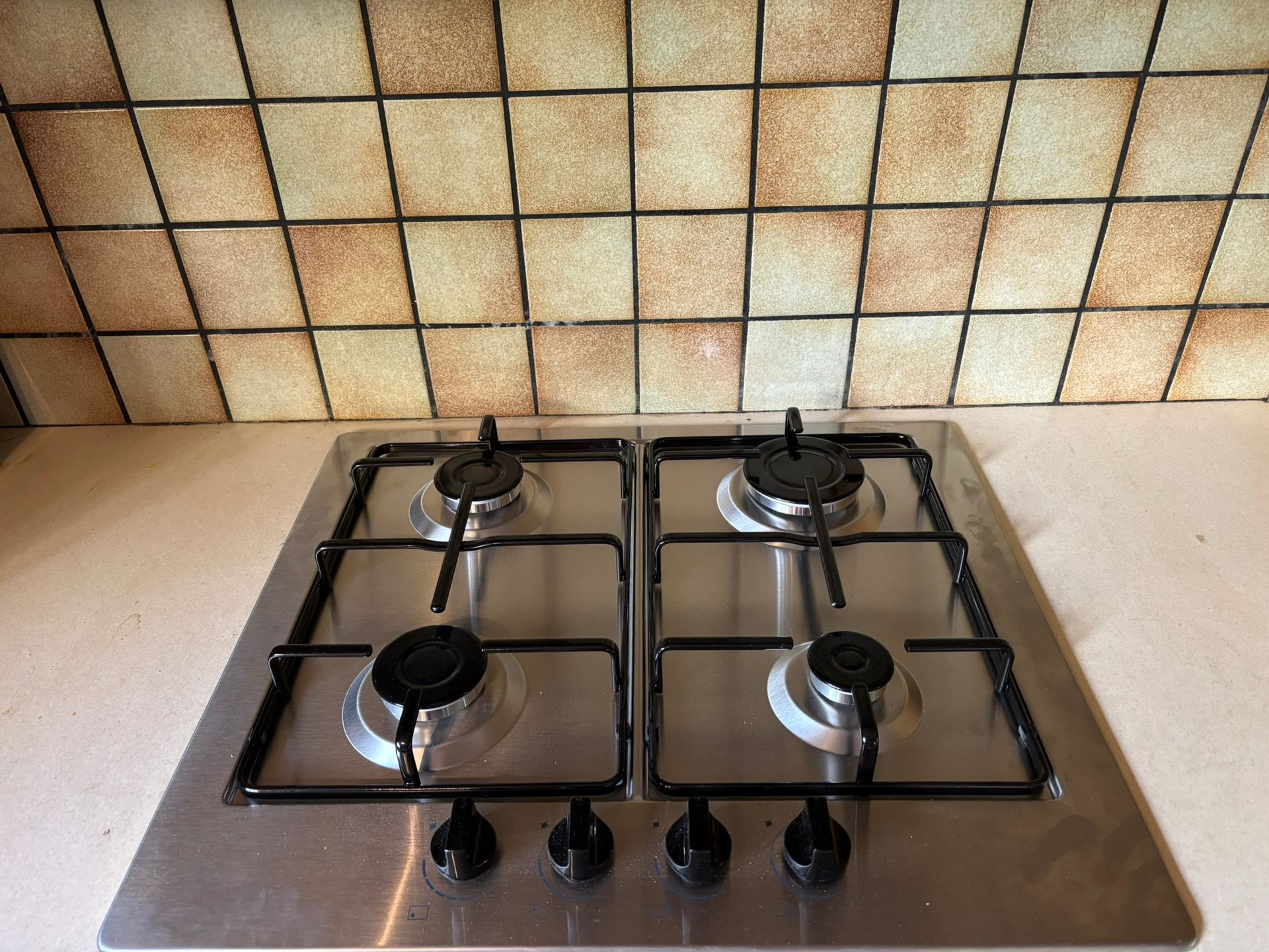 Before and after hob, installation involving cutting out kitchen worktop