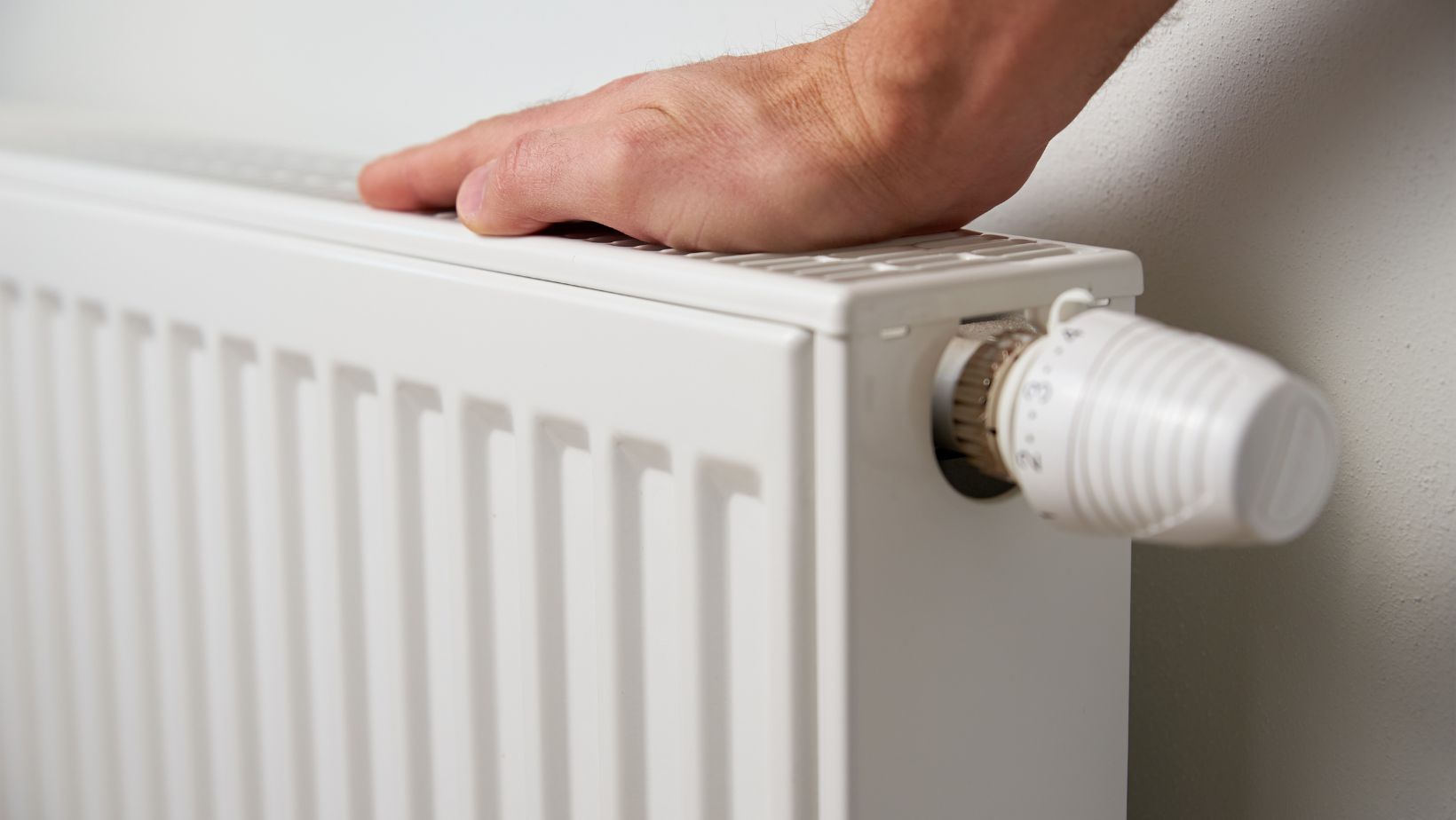 Heating engineer repairing radiator leak in Caversham Berkshire