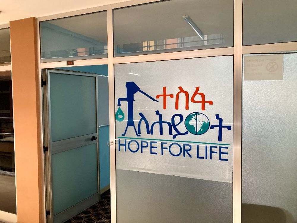 A window with a sign that says hope for life