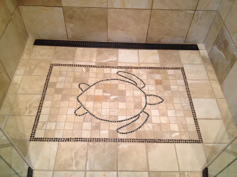 A tiled floor with a picture of a turtle on it