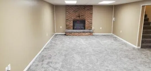 There is a fireplace in the middle of the room.