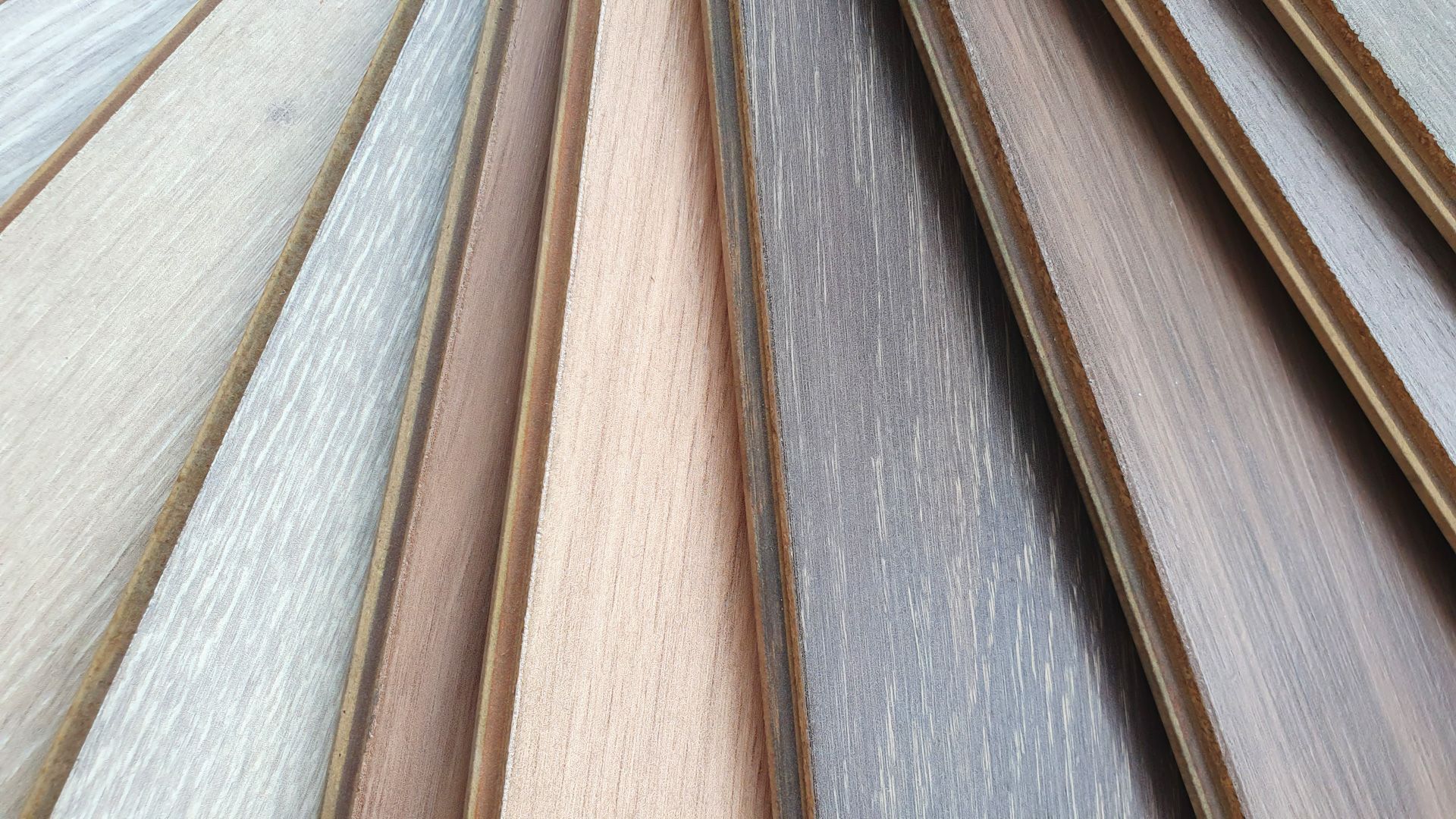 A close up of a stack of different types of wood