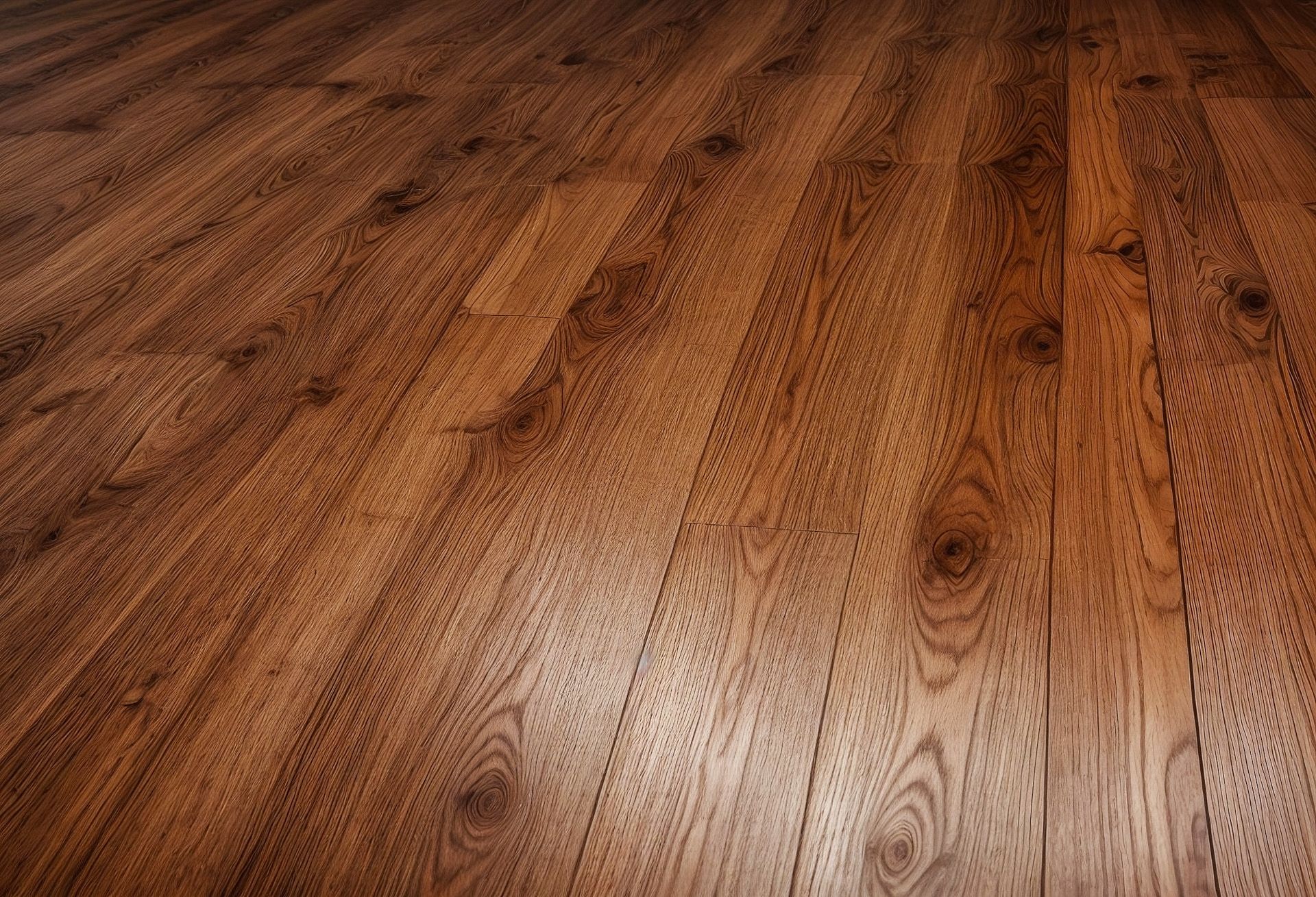 A close up of a wooden floor in a room.