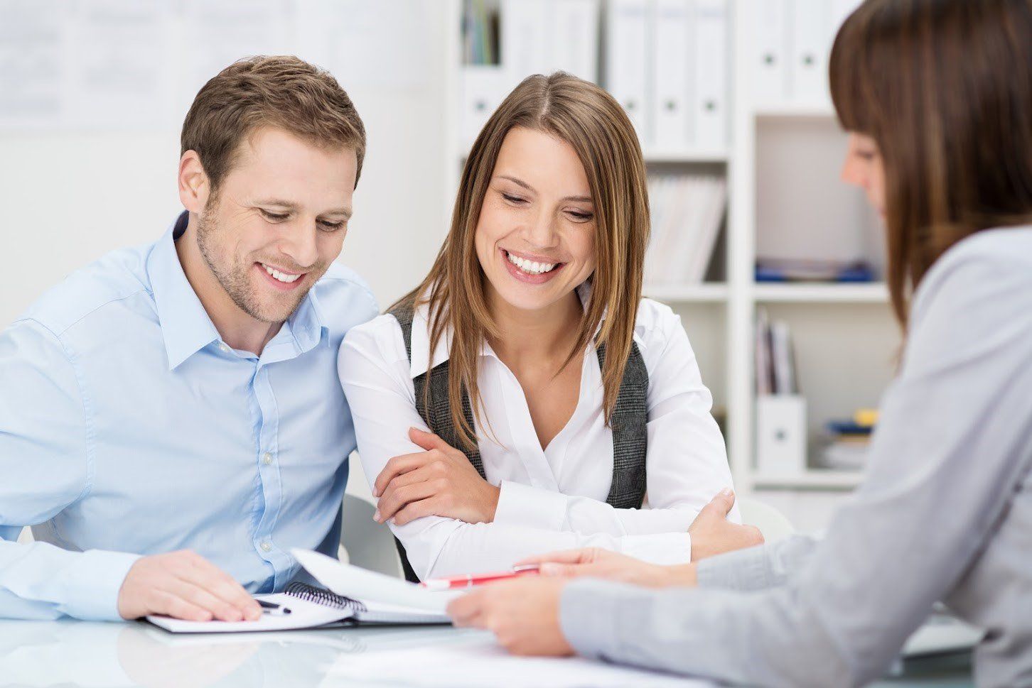 Couple Smiling While Talking to A Woman — Florissant, MO — Ardmore Finance Master Finance Couple Smiling While Talking to A Woman — Florissant, MO — Ardmore Finance Master Finance