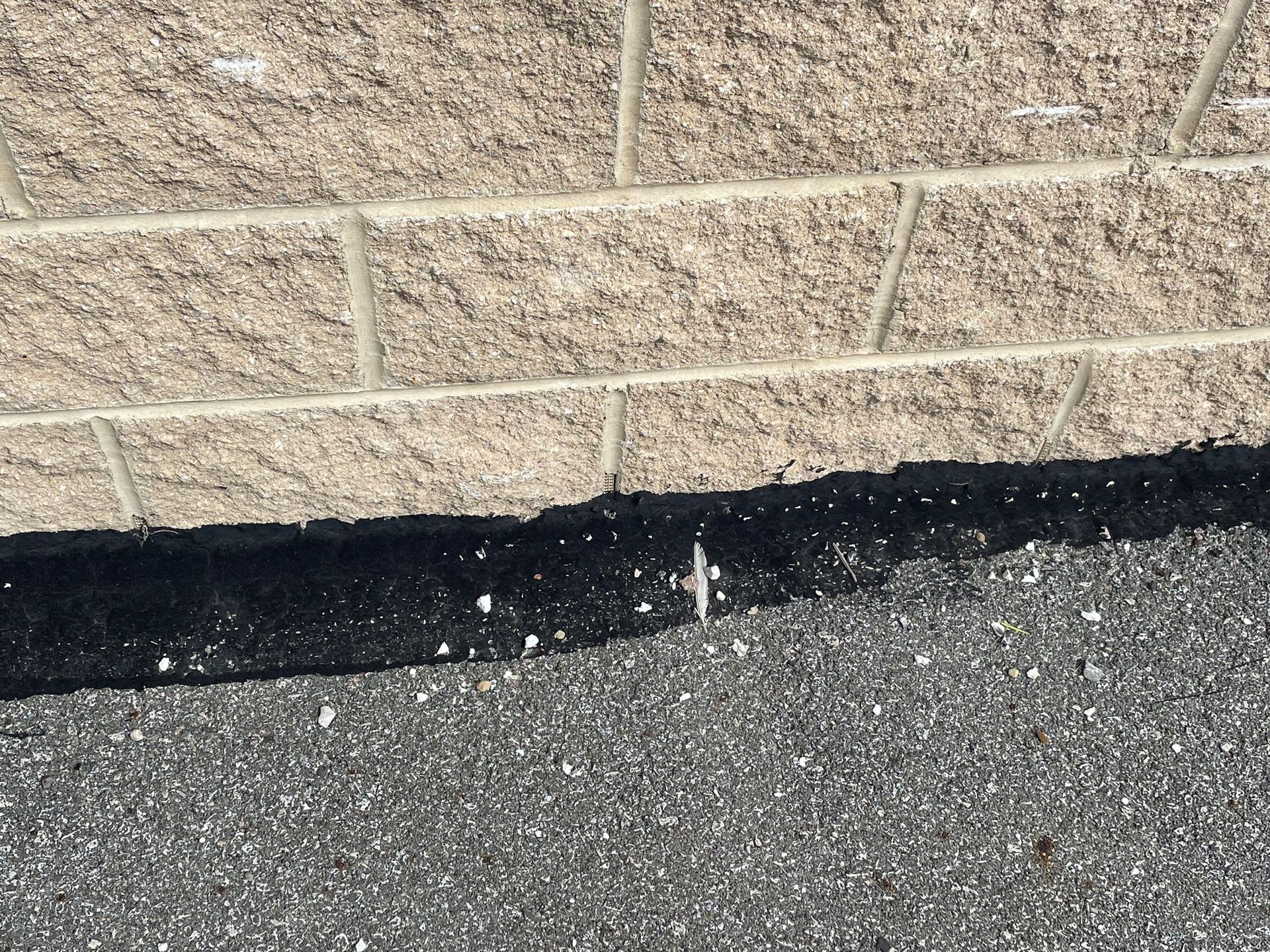 Black liquid sealer used for waterproofing a Historical building by Authentic Restoration & Waterpro