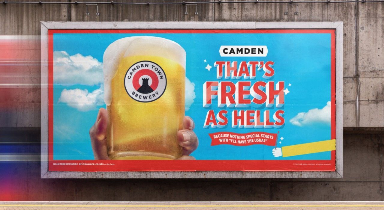 Billboard ad for Camden beer: hand holding frothy beer, slogan