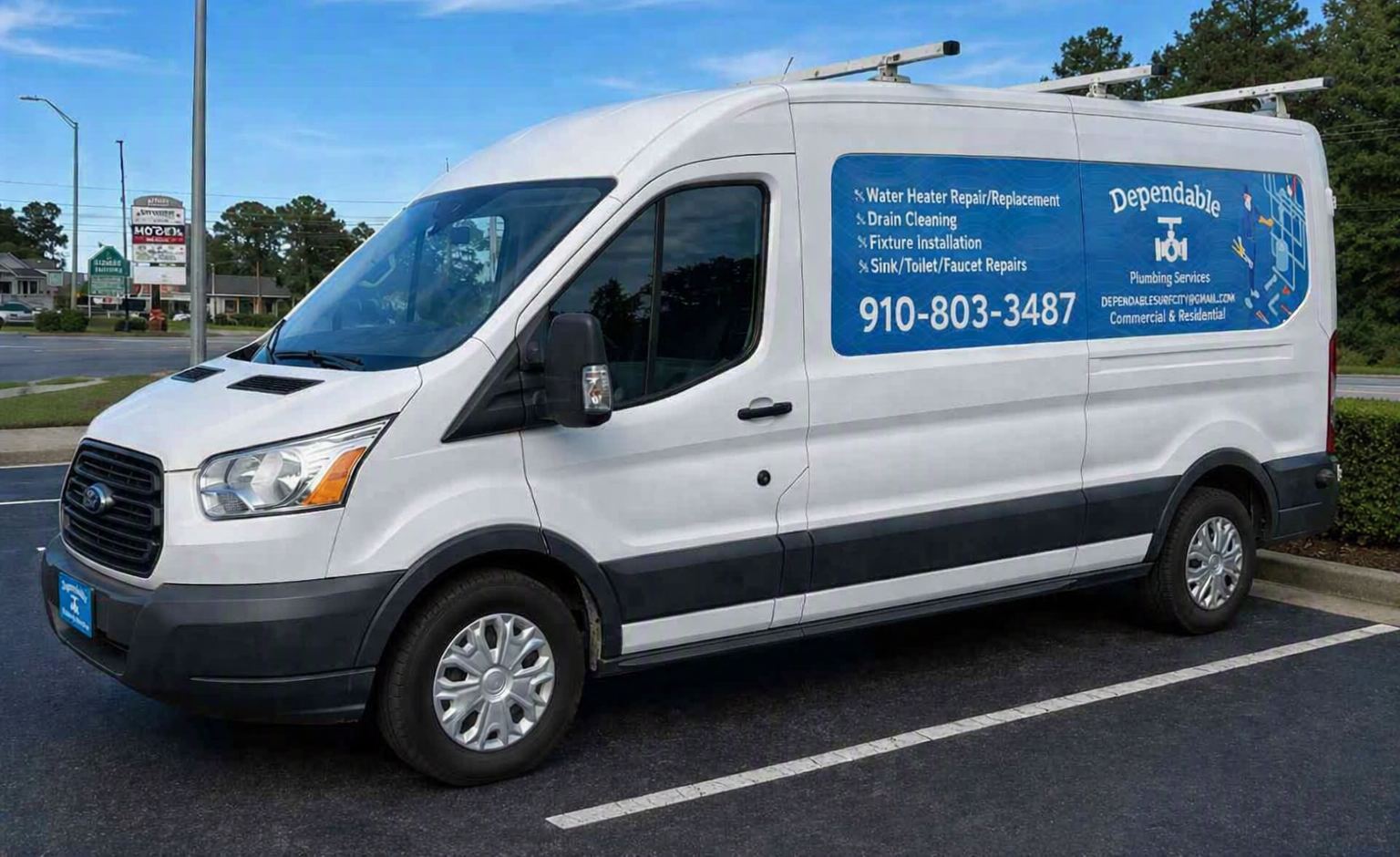 White service van with blue logo and phone number parked in a lot