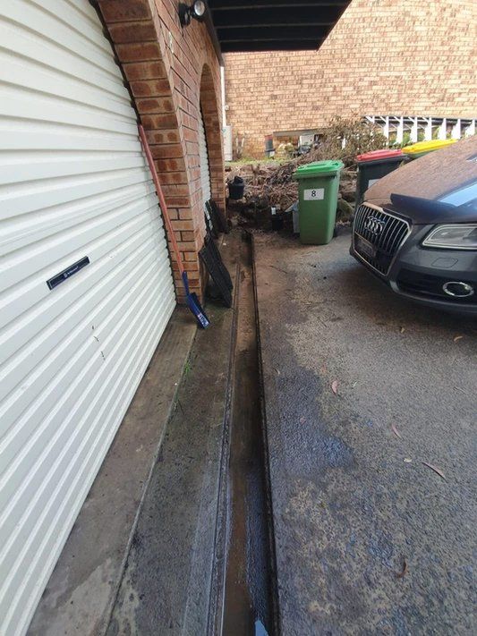 After Cleaning The Gutter On The Garage — TK Guttercleaning in Hamlyn Terrace, NSW