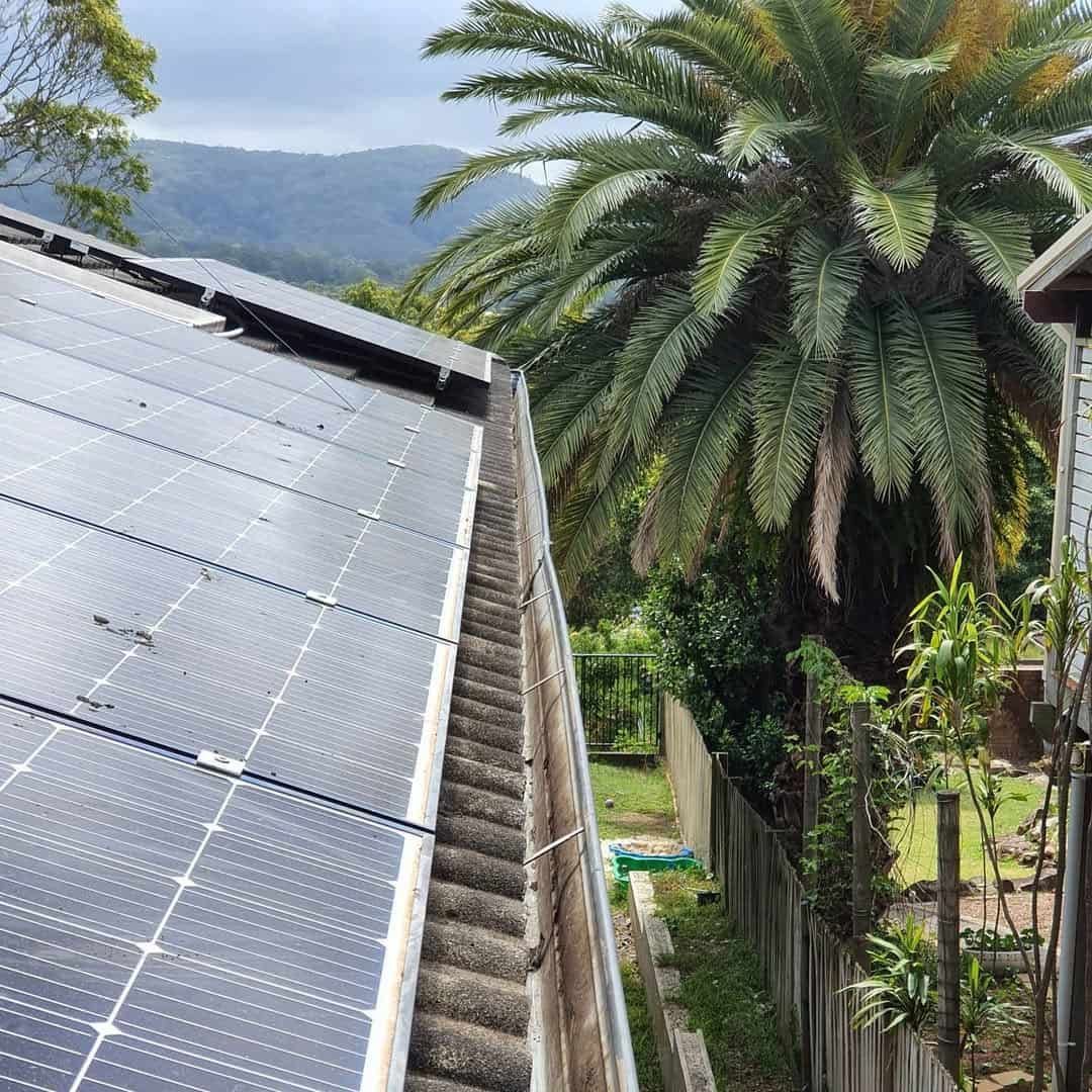There Are Many Solar Panels on the Roof of a House — TK Guttercleaning in Hamlyn Terrace, NSW