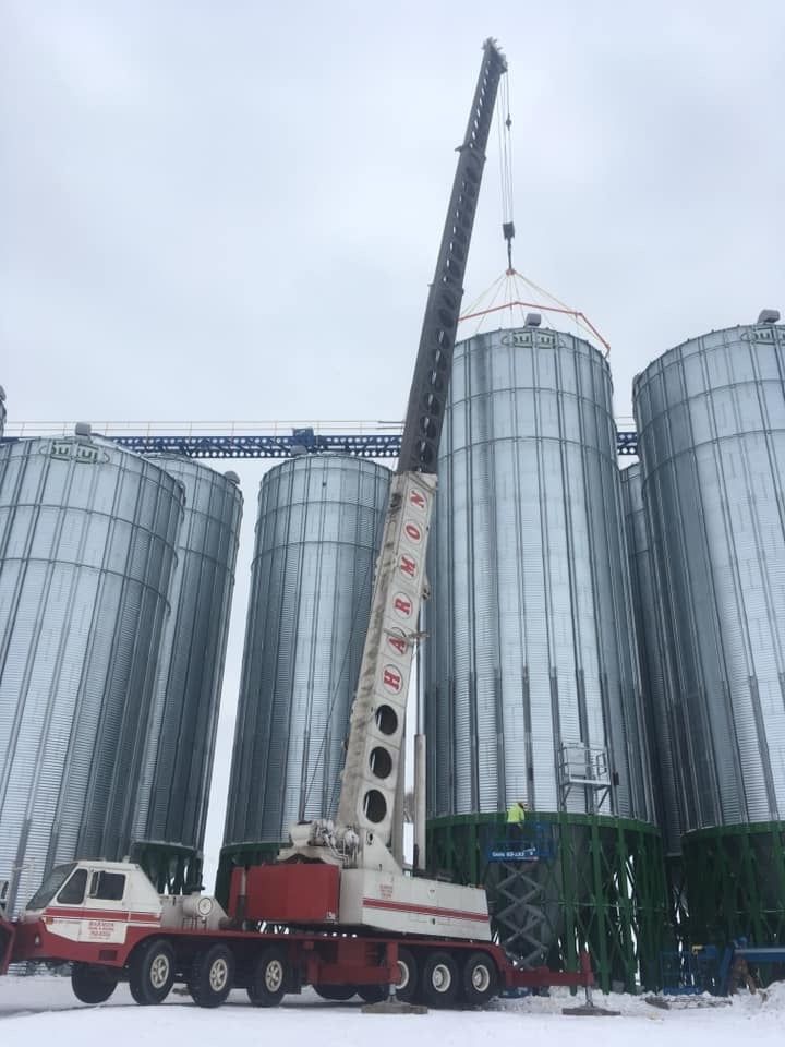 Crane erecting grain silo