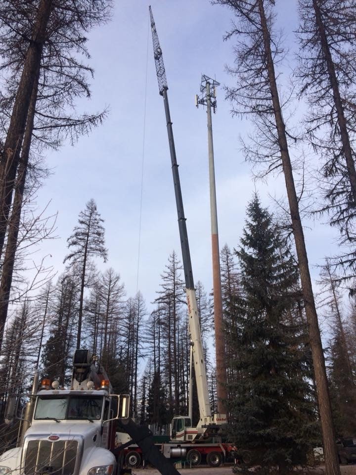 Crane/boom working on cell tower