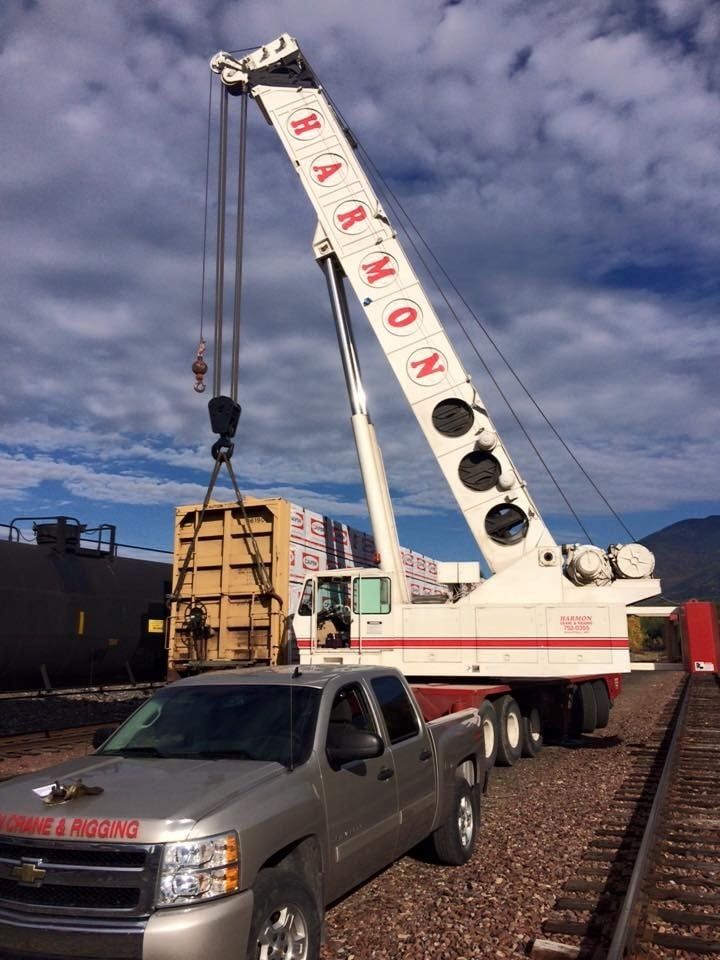 Grove crane lifting loaded rail car