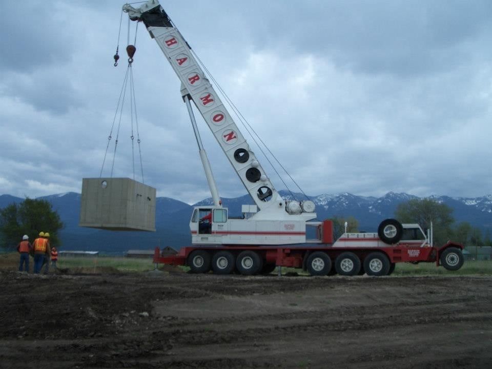 Grove crane preparing vault set