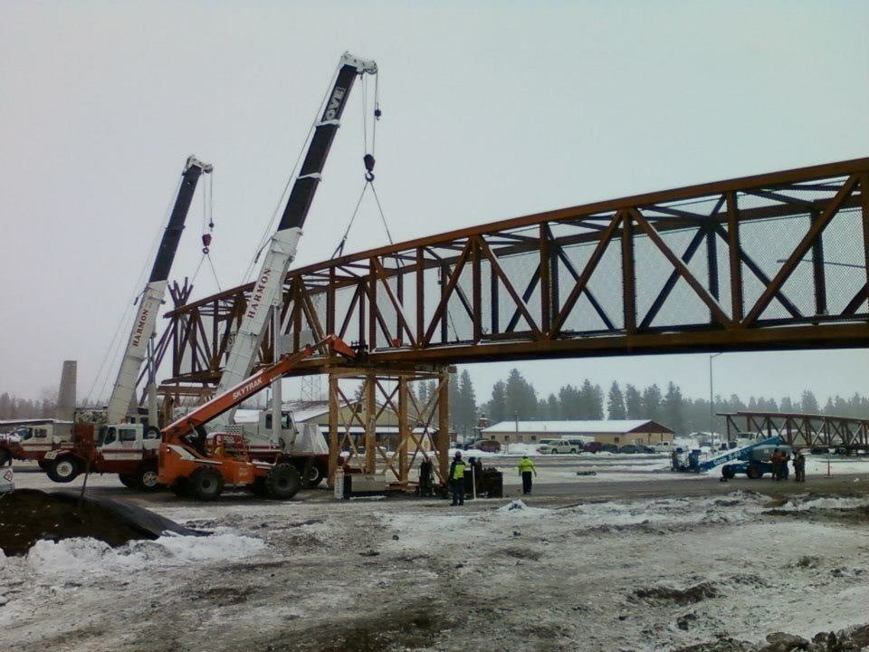 Crane setting pedestrian bridge