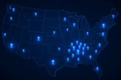 Blue glowing map of the United States with illuminated city points against a dark background