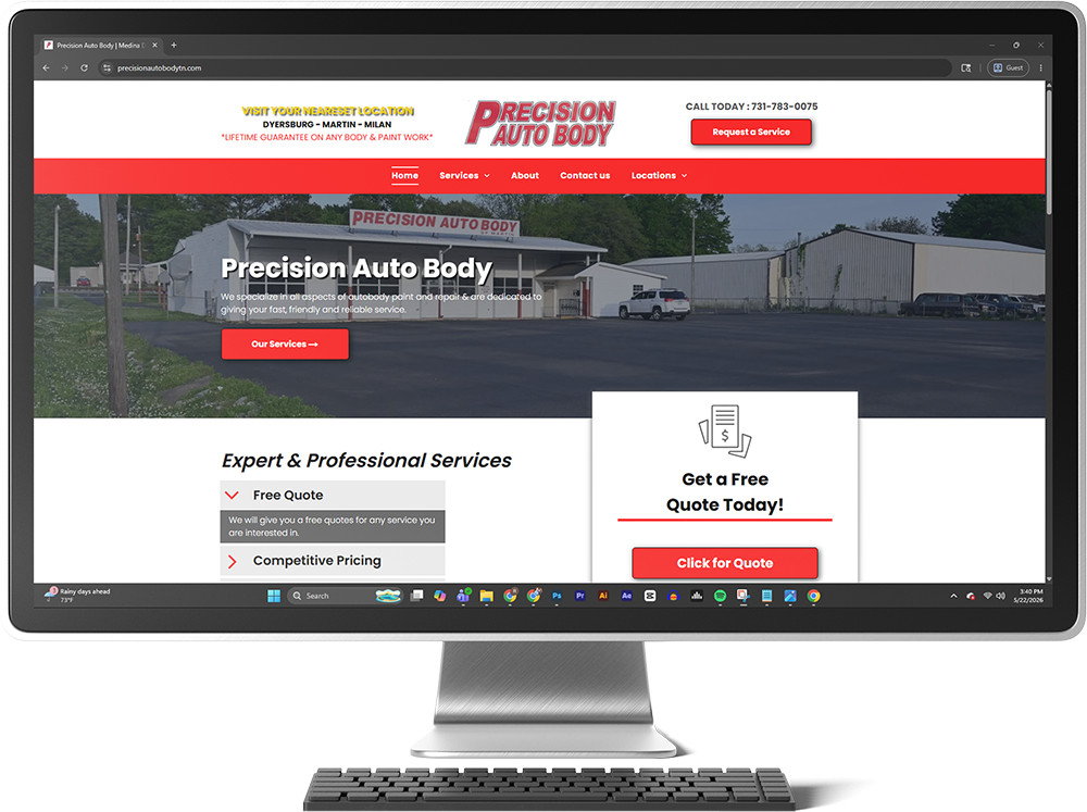 Desktop monitor displaying the Precision Auto Body website with red header and shop photo on screen