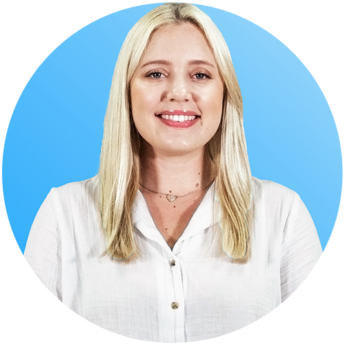 Smiling blonde professional in a black-and-white checkered blazer against a blue background