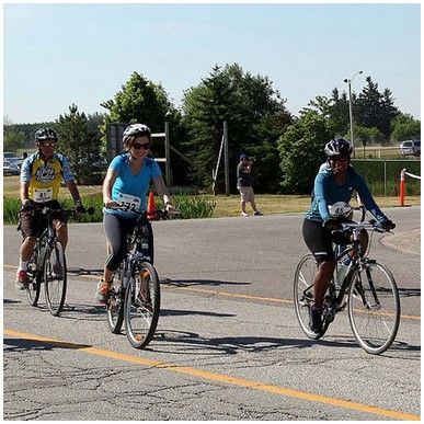 Staff riding bikes in Healing Cycle Foundation fundraiser