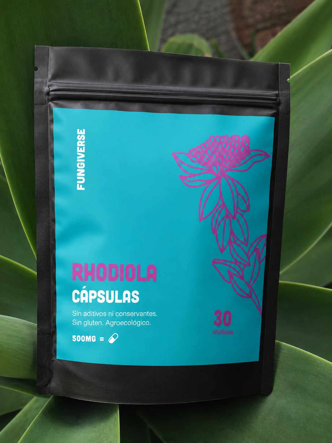 Bolsita de cápsulas de rodiola negras y turquesas con diseño floral rosa y fondo vegetal.