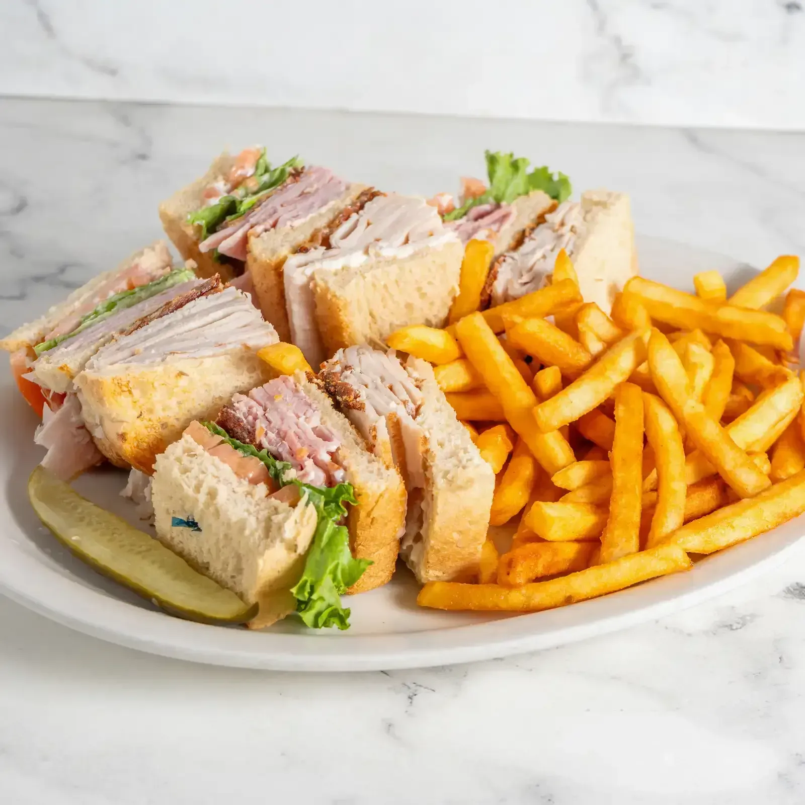 Club sandwich with fries at Hollywood Family Café & Catering Lodi