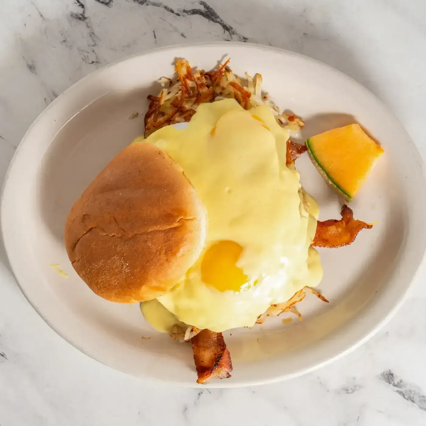 Breakfast sandwich with egg and melted cheese at Hollywood Family Café Lodi