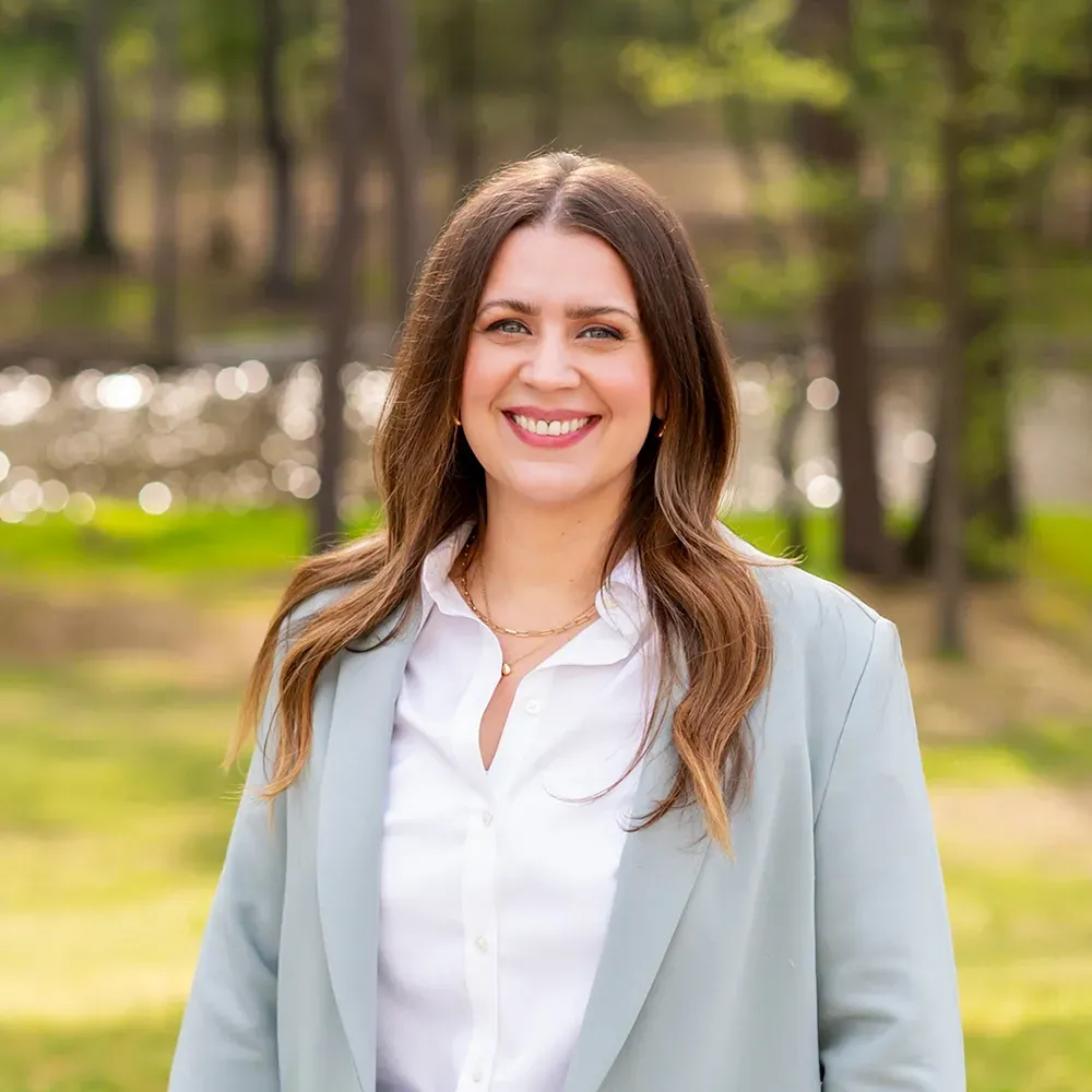 Smiling woman in a light blazer