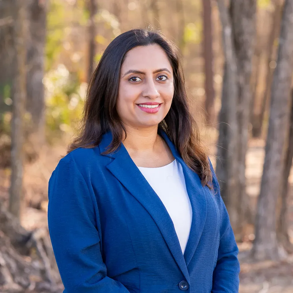 Woman in a blue blazer standing